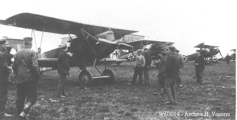 German airfield personnel show interest in an early production Fokker D.VII.<br />In the background Fokker Dr.I’s and an Albatros D.Va can be seen.